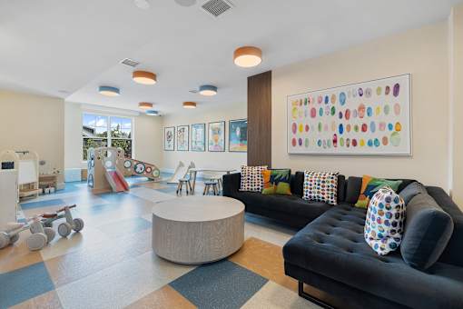 Colorful childrens playroom with toys and seating at Aster Grove Apartments, Warren, NJ 07059