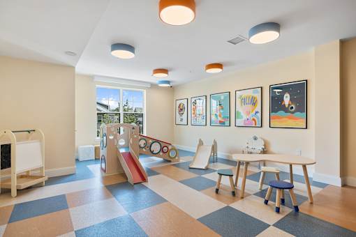 Childrens playroom with colorful ceiling lights at Aster Grove Apartments, Warren, NJ