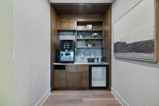 Built in coffee bar with beverage center and shelving at Aster Grove Apartments, Warren