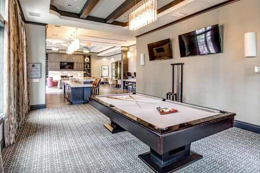 Game room with pool table and wall mounted television at Highlands at Hilltop Apartments, New Jersey, 07044