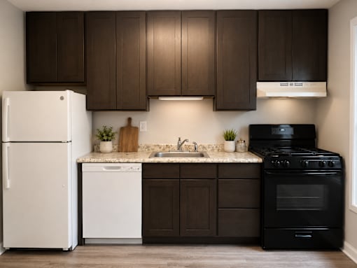 A kitchen with brown cabinets and a black stove.