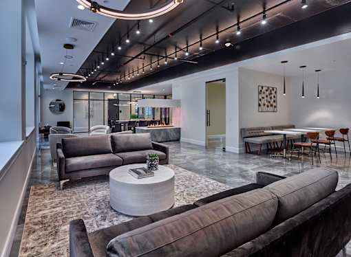 a living room with couches and a coffee table
