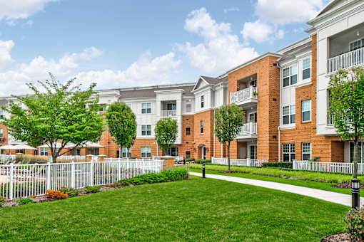 Apartment buildings with brick facade and white balconies at Highlands at Hilltop Apartments, Verona, NJ 07044