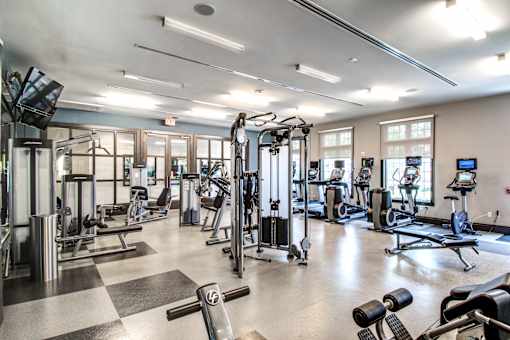 Fitness center with cardio machines and strength training equipment at Highlands at Hilltop Apartments, Verona, 07044