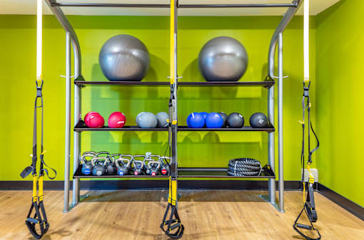 Functional training area with suspension straps and equipment storage at Inwood at Renaissance Square Apartments, New Jersey, 08053