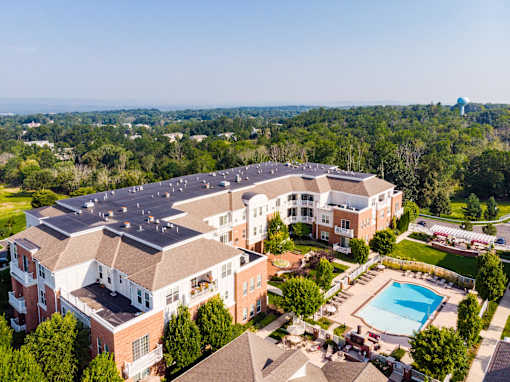 Aerial view of apartment community with swimming pool and courtyard at Highlands at Hilltop Apartments, Verona, NJ 07044