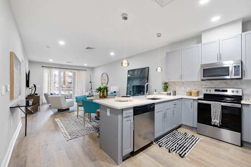 Open concept kitchen and living area with light gray cabinetry at Highlands at Hilltop Apartments, Verona, NJ