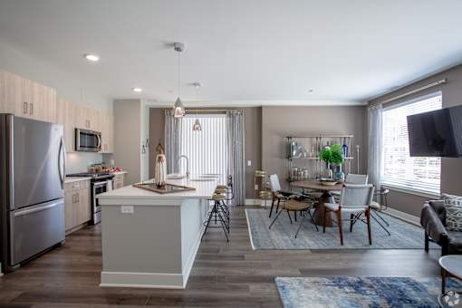 Open concept living and dining space with kitchen island at Inwood at Renaissance Square Apartments, Marlton, NJ
