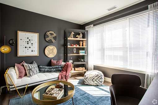 Cozy living room with modern furniture and decorative accents at Inwood at Renaissance Square Apartments, Marlton, New Jersey