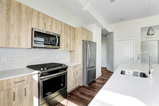 Modern kitchen with steel appliances at Inwood at Renaissance Square Apartments, New Jersey, 08053