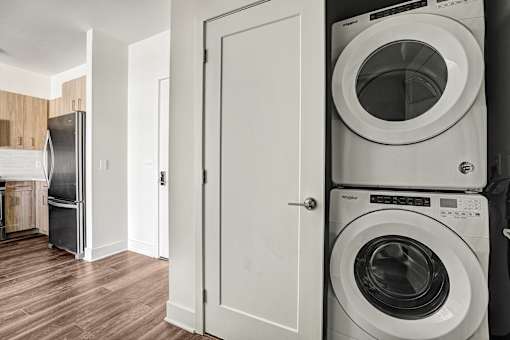 Stacked washer and dryer in laundry closet at Inwood at Renaissance Square Apartments, Marlton