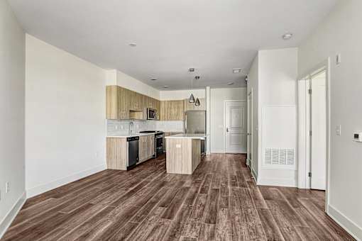 Open living space with wood cabinetry and peninsula at Inwood at Renaissance Square Apartments, Marlton, NJ 08053