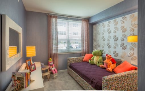 Colorful kids bedroom with decorative wall panel at RiverParc Apartments, Weehawken, NJ