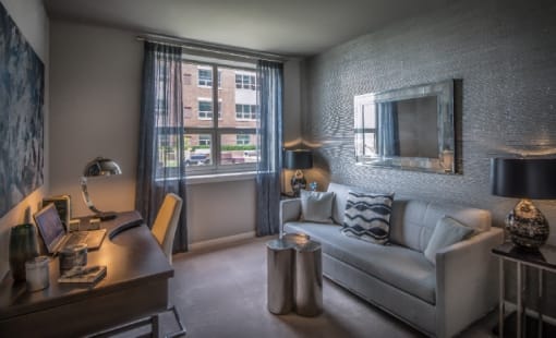 Contemporary studio with workspace and lounge area at RiverParc Apartments, Weehawken, 07086