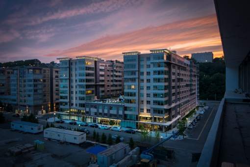 Exterior view of modern residential buildings at sunset at RiverParc Apartments, Weehawken