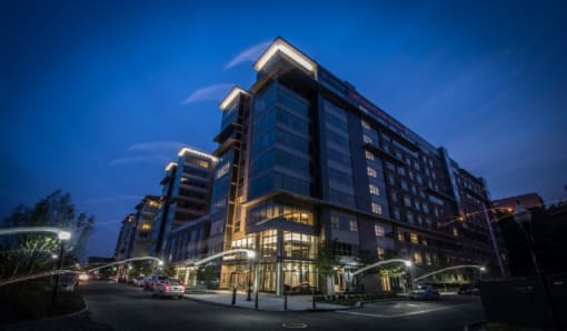 Modern apartment building exterior at dusk at RiverParc Apartments, New Jersey