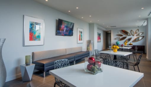 Resident lounge with modern seating and artwork at RiverParc Apartments, New Jersey