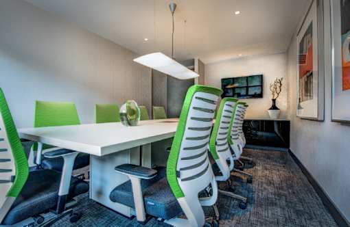 Conference room with green office chairs at RiverParc Apartments, Weehawken, NJ 07086