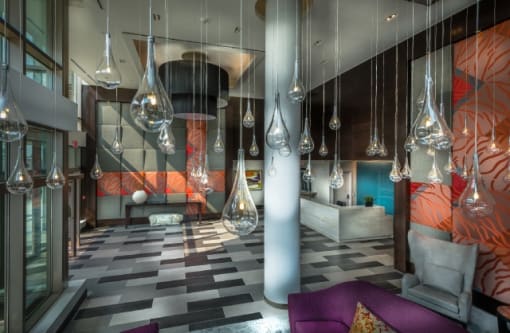 Modern lobby with art glass pendant lighting at RiverParc Apartments, Weehawken, 07086