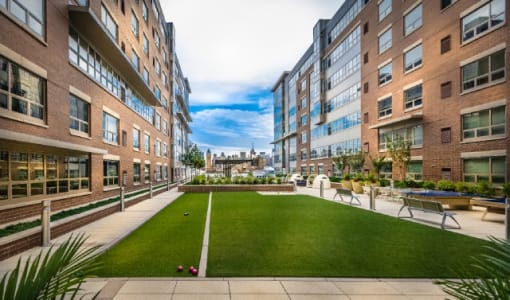 Courtyard with lawn and residential buildings at RiverParc Apartments, New Jersey
