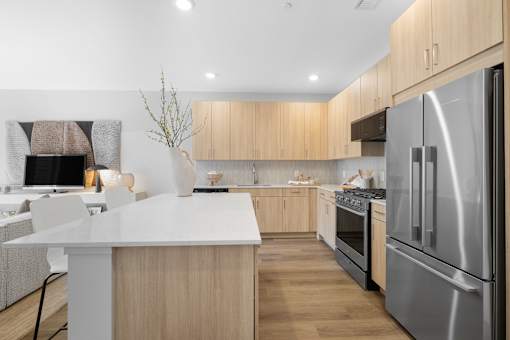 Stainless steel refrigerator in kitchen at The Lawrence, New Jersey, 07054