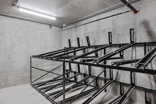 A metal rack in a white room.