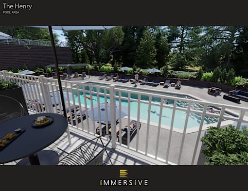 A pool area with a table and chairs and a sign that says "The Henry".