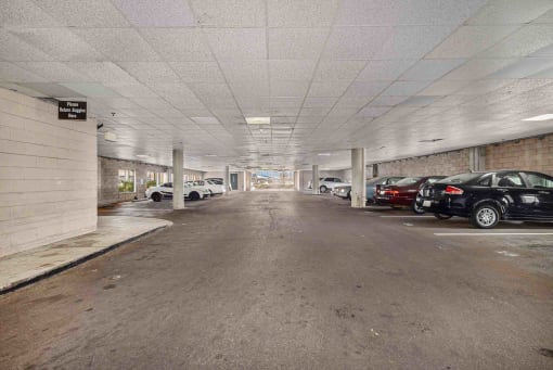 a parking garage with cars parked in it