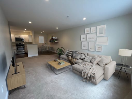 a living room filled with furniture and a large window