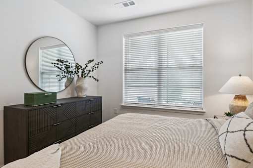 Bedroom With Expansive Windows at The Liliana Apartment Homes, Pooler