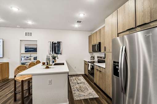 Modern kitchen with island and stainless steel appliances at Velara Luxury Apartments, Ponte Vedra Beach, 32081