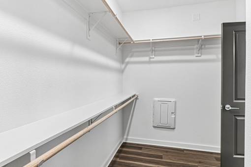 Spacious walk-in closet with storage shelving at Velara Luxury Apartments, Ponte Vedra Beach, FL 32081