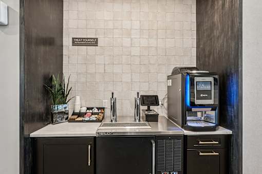 A bathroom with a toilet, sink, and a computer at The Stadler Luxury Apartments, Florida 34210