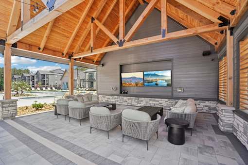 Outdoor Lounge With TV at The Pullman Luxury Apartments, Atlanta, Georgia