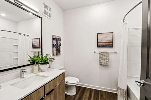 Bathroom with white vanity and walk-in shower at Velara Luxury Apartments, Florida, 32081