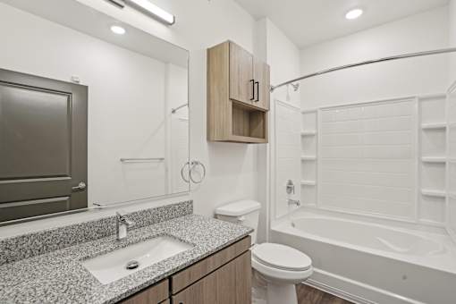 Bathroom With Bathtub at The Pullman Luxury Apartments, Georgia