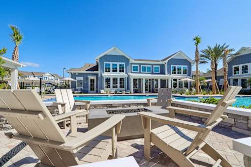 Poolside fire pit lounge with adirondack chairs at Velara Luxury Apartments, Ponte Vedra Beach, FL 32081