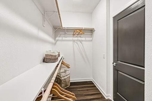 Walkin closet with hanging rods and shelf storage at Velara Luxury Apartments, Florida, 32081