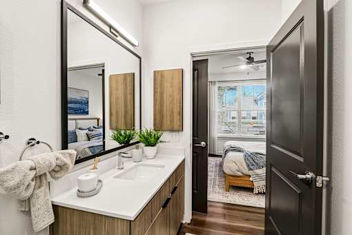 Ensuite bathroom with view into master bedroom at Velara Luxury Apartments, Ponte Vedra Beach, Florida