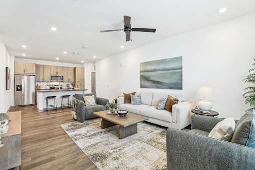A modern living room with a grey couch and a coffee table.