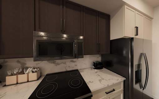 Kitchen with stove top oven at The Union Flats at Fishers District, Fishers, IN, 46037