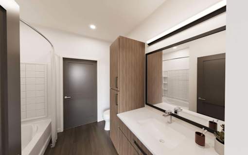 Bathroom with sink and mirror at The Union Flats at Fishers District, Fishers, 46037