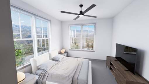 A bedroom with a large bed and a flat screen TV at Refinery at Pointe17 Apartments, Phoenix, AZ, 85085