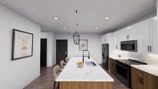 A modern kitchen with a marble island and pendant lighting at Refinery at Pointe17 Apartments, Phoenix
