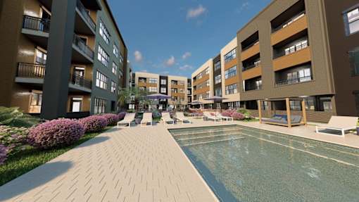 A swimming pool is surrounded by apartment buildings and landscaping.