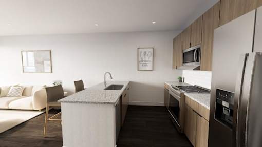 modern kitchen with a white island and stainless steel appliances at The Logan Luxury Apartments, Nampa, ID