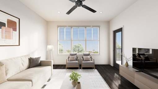 A living room with a couch, a chair, a plant, and a television.