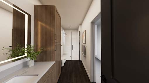 A modern bathroom with a dark wood floor and white walls.