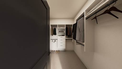 A walk in closet with clothes hanging and shelves.