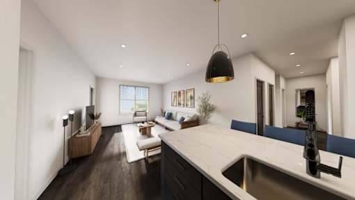 A modern kitchen with a large island and a dining area.